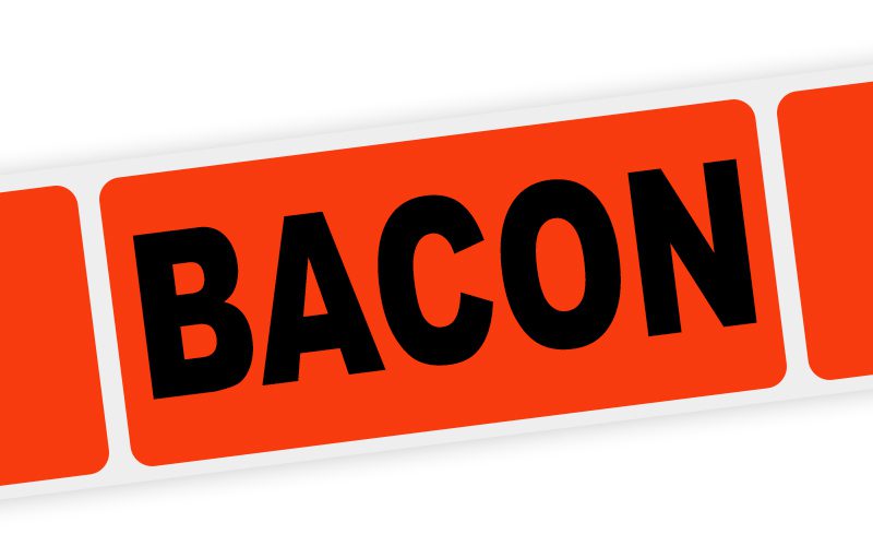 A florescent-red adhesive label with the word 'Bacon' on it