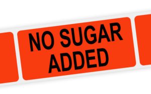 A florescent-red adhesive label with the words 'No-Sugar Added' on it